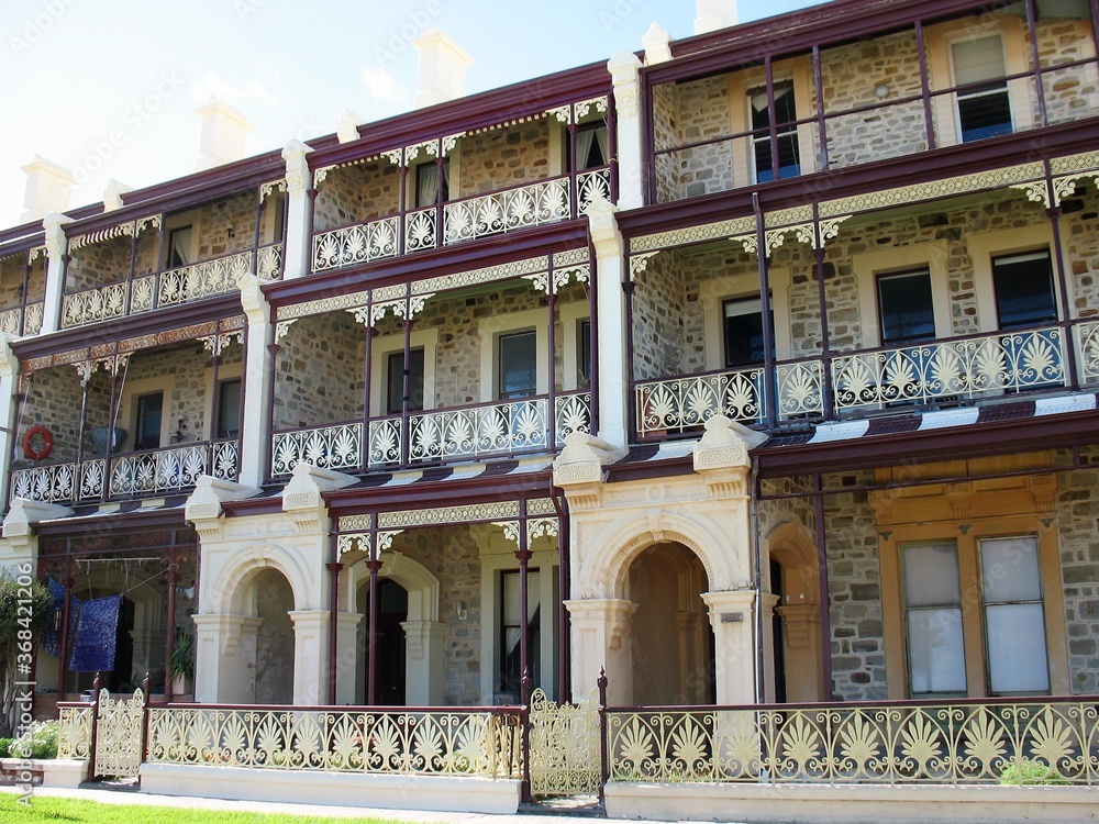 Naklejka premium Victorian bluestone and sandstone three story terrace houses in adelaide