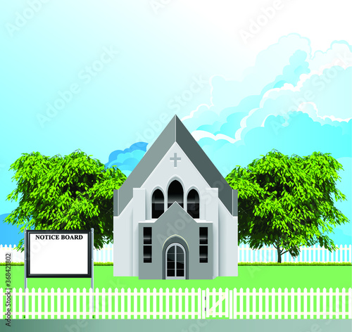 Rural Christian parish church building with blank notice board for own text set against a blue cloudy sky