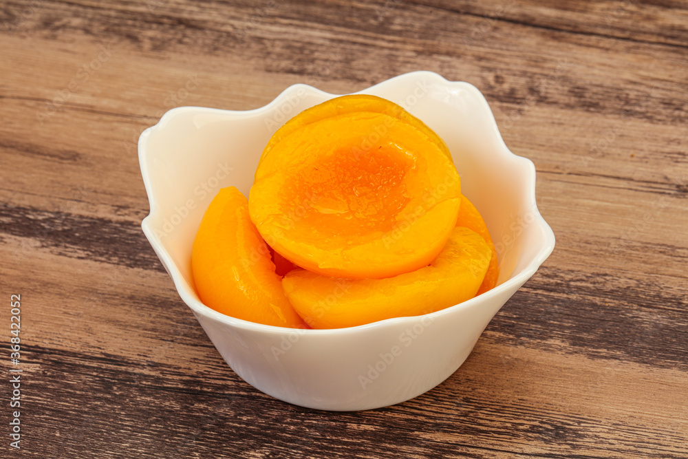 Marinated peaches fruit in the bowl Marinated peaches fruit in the bowl