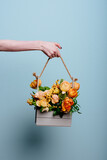 Bouquet of flowers in a wooden box