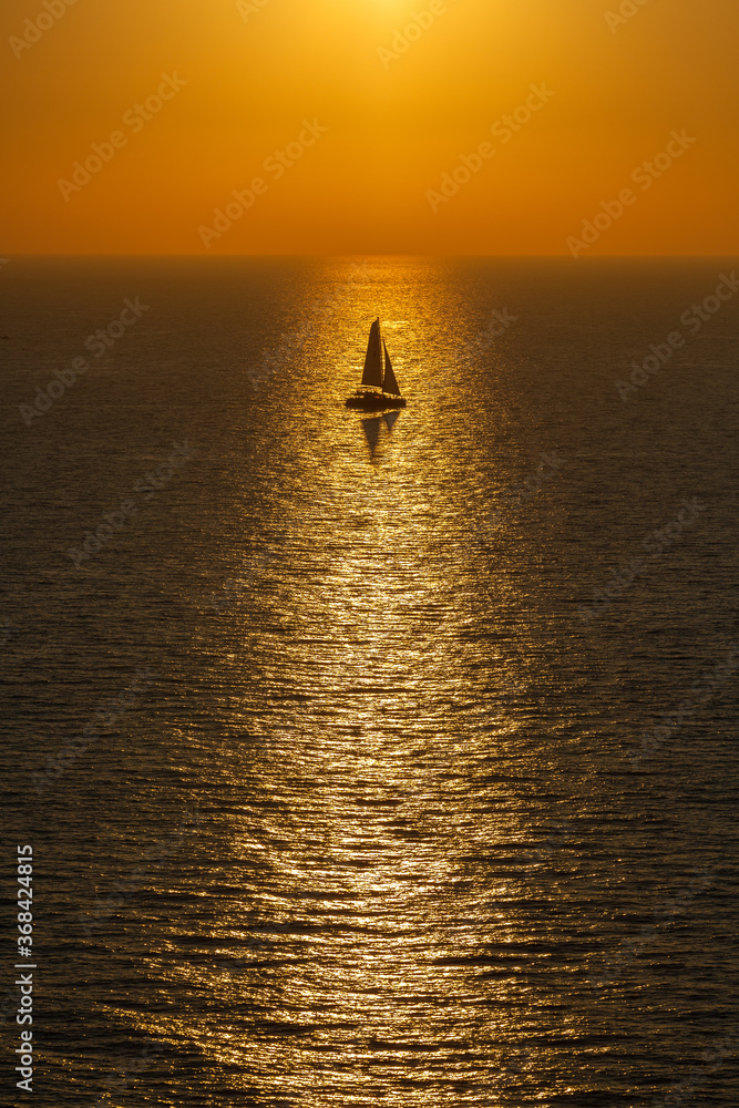 sunset with yachts on santorini island sunset with yachts on santorini island