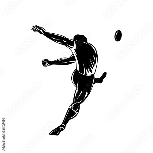 Rugby Player or Kicker Kicking the Ball Viewed from Rear Retro Woodcut Black and White