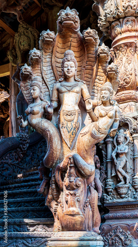 From a distance you awe at the Sanctuary of Truth in Pattaya, Thailand. When you get closer, the admiration of the wood temple becomes even greater because of the abundance of details - here a statue.