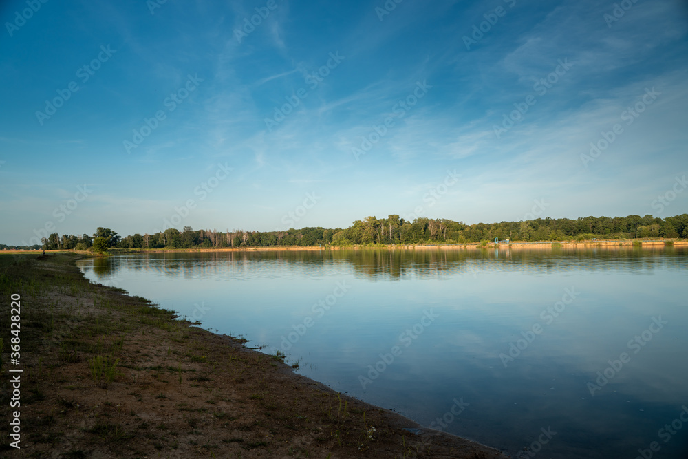 lake in the forest, flooded quarry lake in the forest, flooded quarry