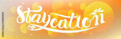 Staycation 2020 - new vacation trend text. Hand drawn lettering poster with tree branch and leaves. Handwritten letter script motivation word art design. Summertime tourism slang illustration. Banner