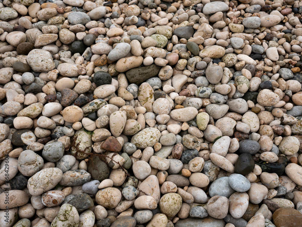 Pebble texture. Stone background. Rocky beach. Sea stones texture Pebble texture. Stone background. Rocky beach. Sea stones texture