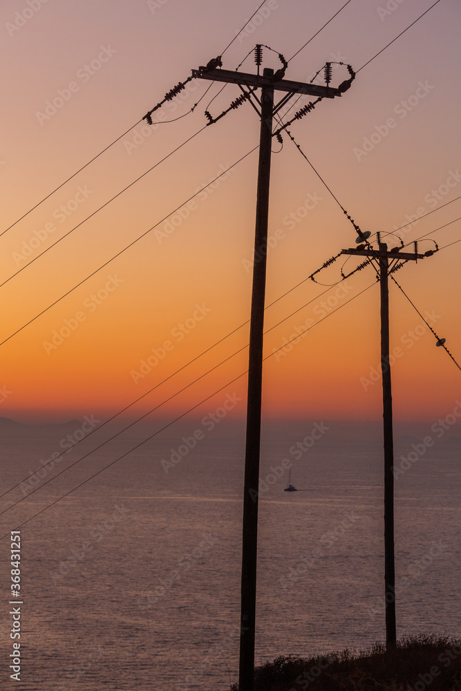 sunset with yachts on santorini island Greece