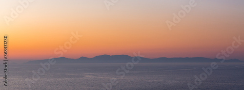 sunset with yachts on santorini island Greece