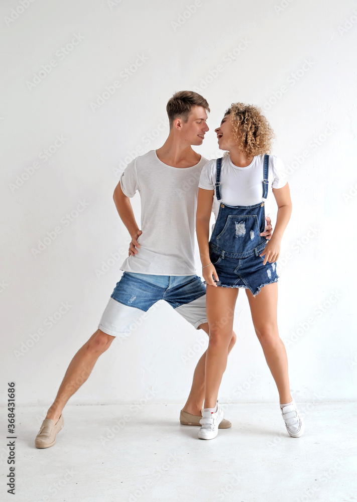 Happy smiling couple dancing in the studio. authencit couple having fun indoors. Happy smiling couple dancing in the studio. authencit couple having fun indoors.