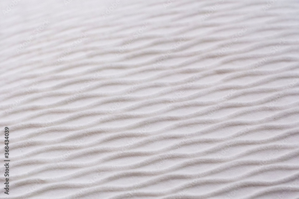 Soft blurred white rib waves fabric texture background. Soft blurred white rib waves fabric texture background.