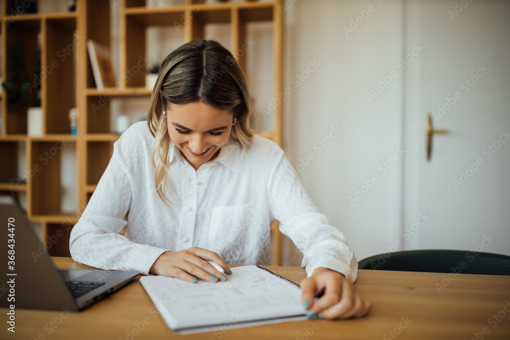Smiling university student studying, portrait. Smiling university student studying, portrait.