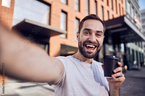 Fun happy with coffee taking selfie outlook
