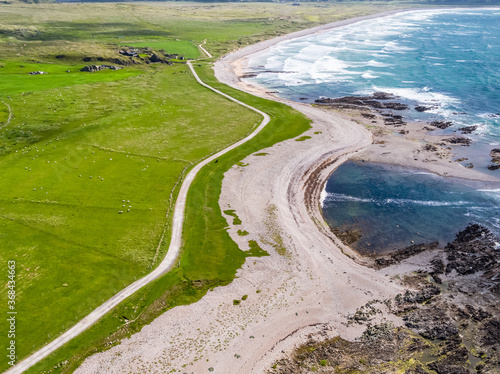 Aerial view of the beautiful coast next to Carrickabraghy Castle - Isle of Doagh, Inishowen, County Donegal - Ireland photo