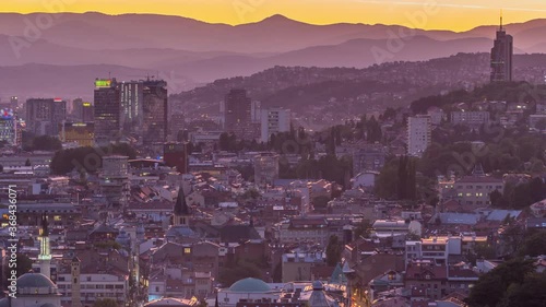 City view of Sarajevo with river from most popular panoramic spot in Sarajevo day to night transition timelapse. Road near Yellow Fortress (Zuta Tabija), Vratnik photo