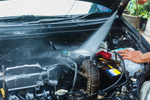 engine Washing,Cleaning Car Using High Pressure Water blur.