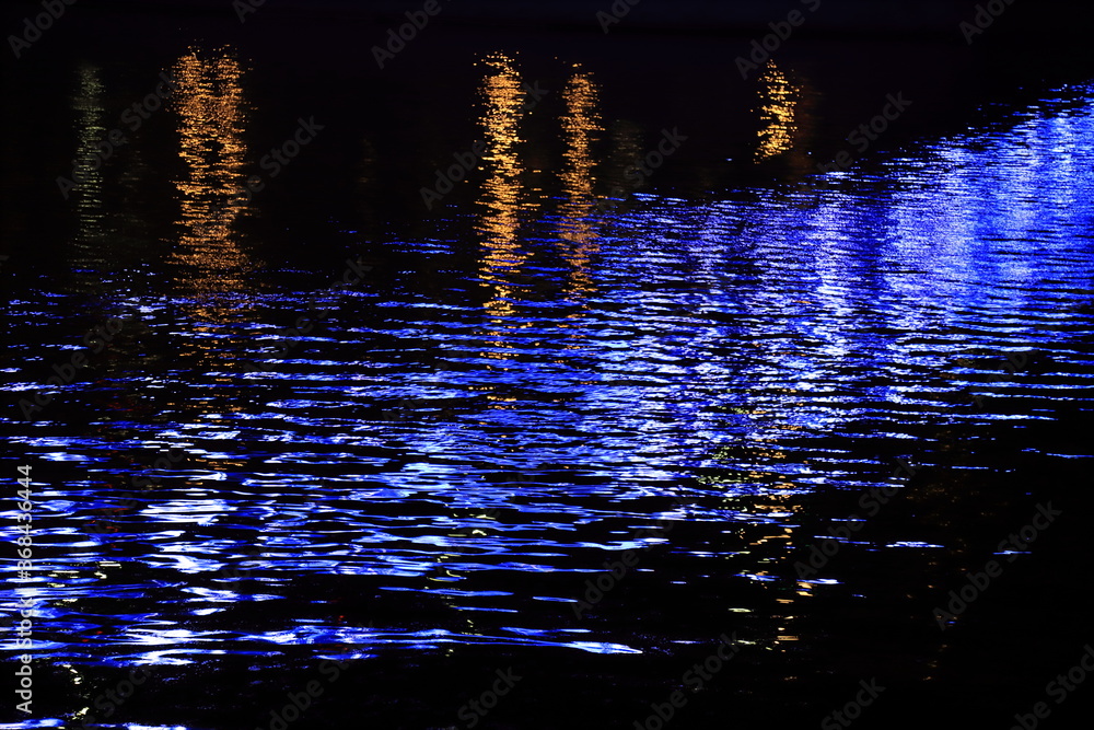 Night city lights reflected in the water Night city lights reflected in the water