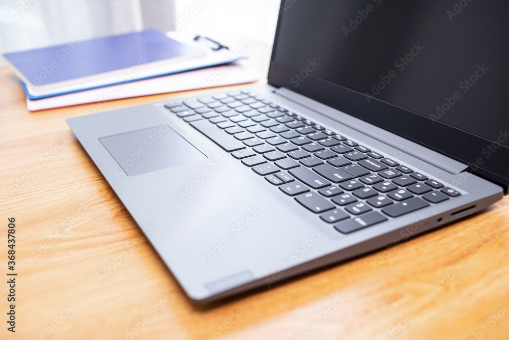 Laptop and folders on desk Laptop and folders on desk