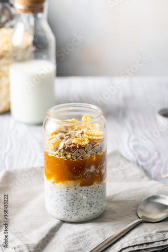 delicious dessert for breakfast. Yogurt with chia seeds, apricot puree and granola