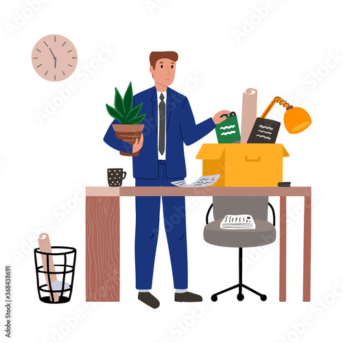 An employee puts his office stationery in a box