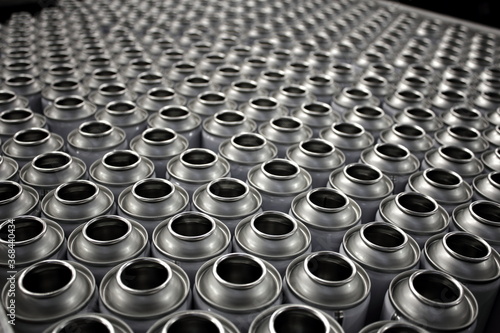 Empty aerosol cans in busy manufacturing business