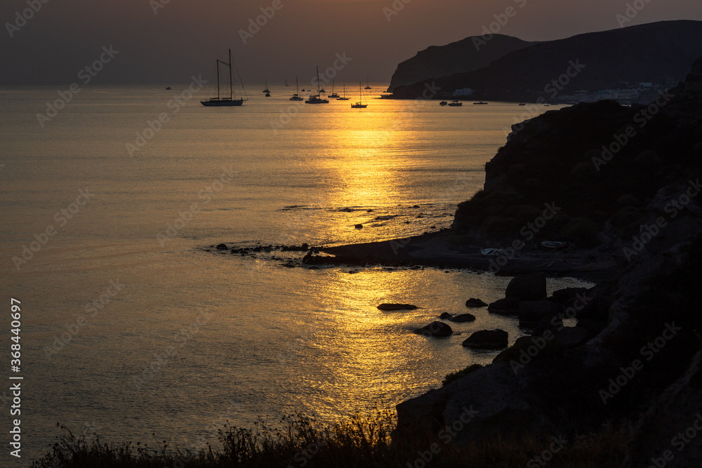 sunset with yachts on santorini island Greece