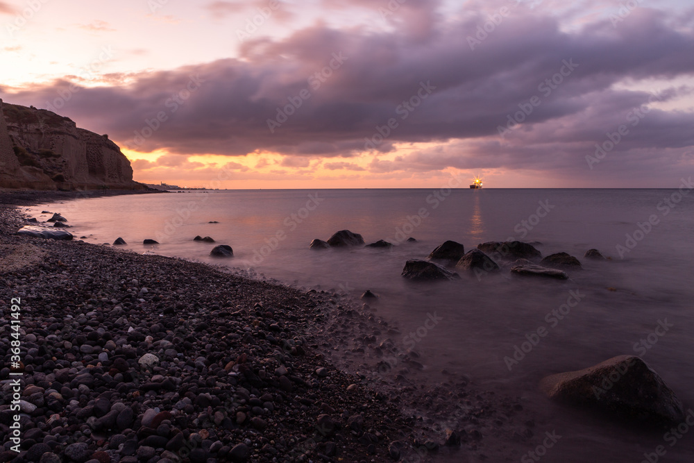 Obraz premium sunset with yahts on Santorini island Greece