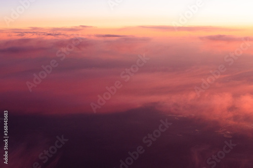 Clouds scape at sunset from above © EriksZ