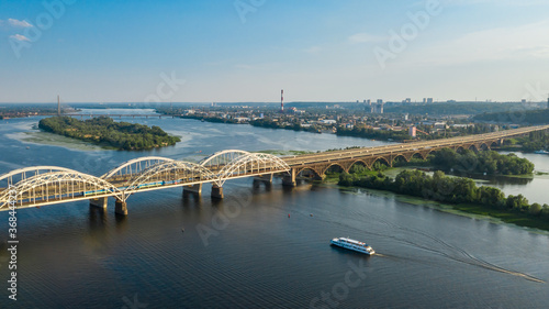 Aerial view of bridge above Dnipro river in Kyiv city at summer day. Urban cityscape background. Kiev, Ukraine