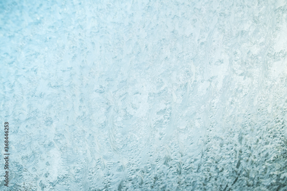 Winter texture background, frost pattern on window. Frosted icy glass
Winter texture background, frost pattern on window. Frosted icy glass