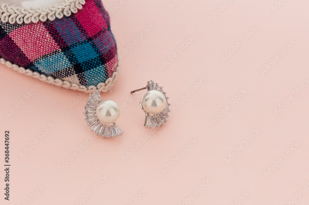 Fototapeta premium Close up of diamond earrings. space for your text.