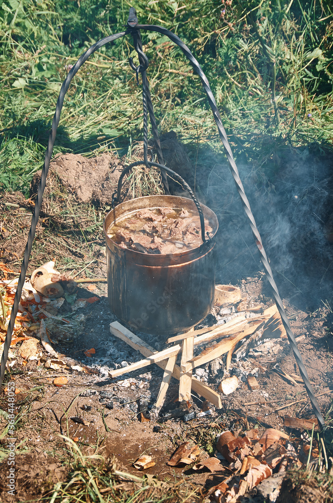 Cooking meat for medieval dinner Cooking meat for medieval dinner