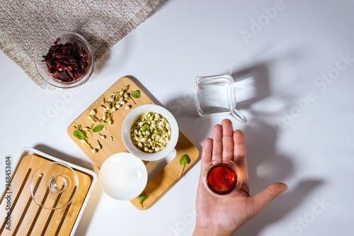 Dry granules of different types of tea. Flatlay, top view. herbal tea, on a white background