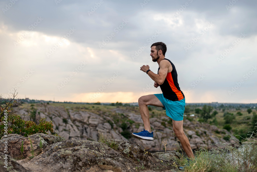 Male runner running over stones, copy of free space. Male runner running over stones, copy of free space.