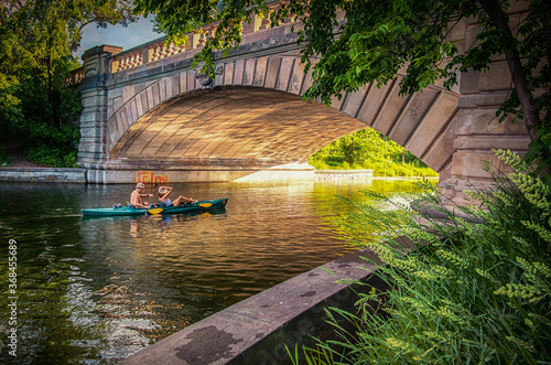 A Saturday evening kayak ride under the bridge at sunset in Minneapolis Minnesota.