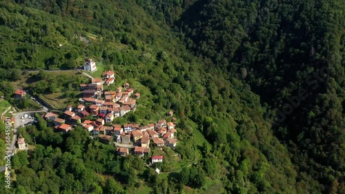 aerial video footage  of village of Topol  municipality of Grimacco, in the province of Udine, region Friuli-Venezia Giulia north-eastern Italy. Small town in Alps mountains. Beautiful nature place  photo