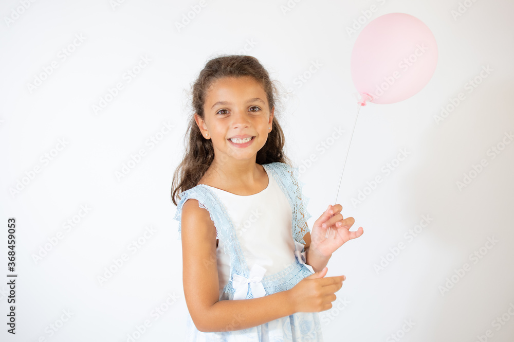 Beautiful girl in blue dress smiling on white background Beautiful girl in blue dress smiling on white background