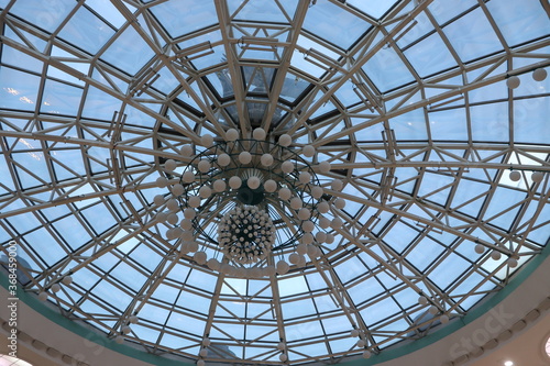 huge lustra hanging on ceiling in mall