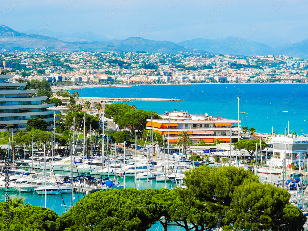Landscape of the beautiful Marina Baie des Anges on against backdrop of Mediterranean Sea with yachts and sailboats. Villeneuve-Loubet. France.