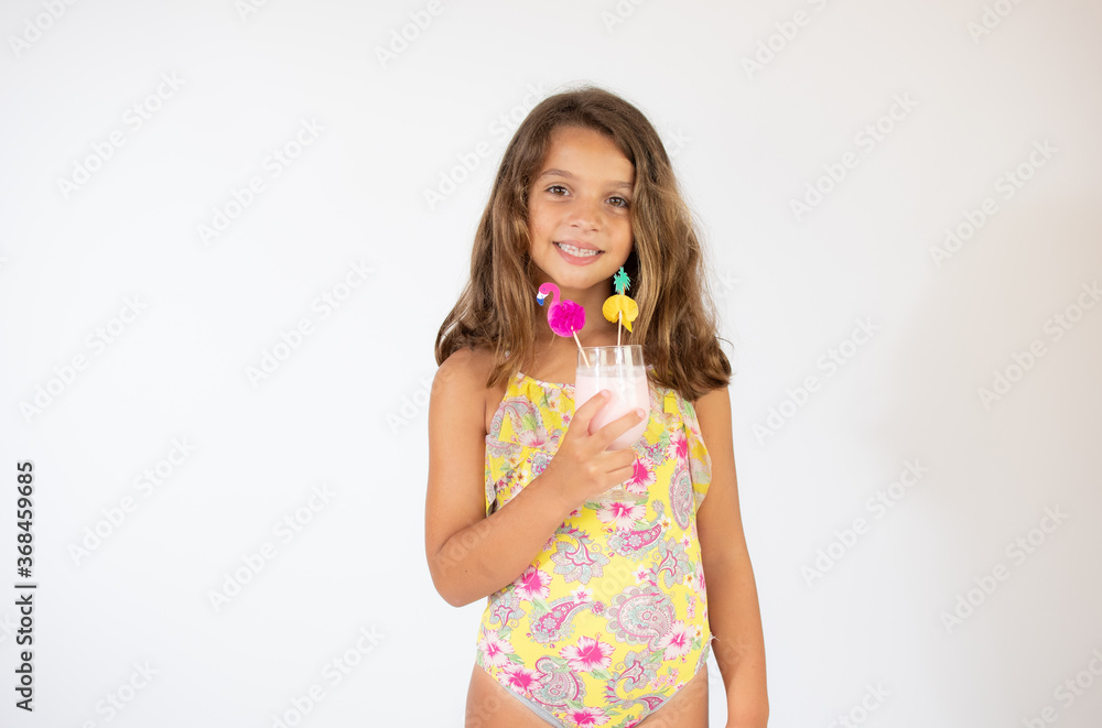 Beautiful girl in colorful swimsuit with a juice Beautiful girl in colorful swimsuit with a juice