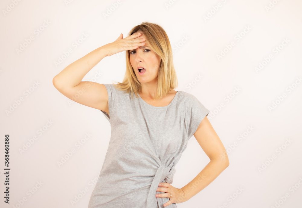 Beautiful woman in grey dress on white background Beautiful woman in grey dress on white background