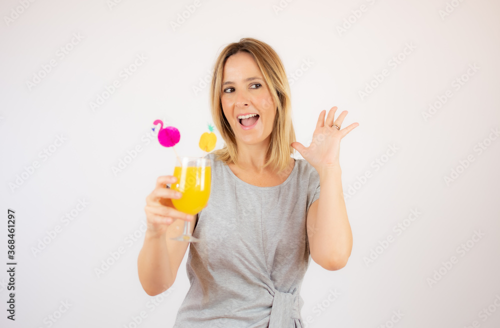 Beautiful woman in grey dress with a cocktail Beautiful woman in grey dress with a cocktail