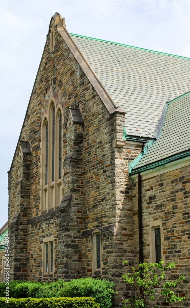 Fototapeta premium The facade of the old brick Christian church building 