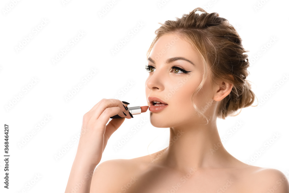 naked beautiful blonde woman applying beige lipstick isolated on white naked beautiful blonde woman applying beige lipstick isolated on white