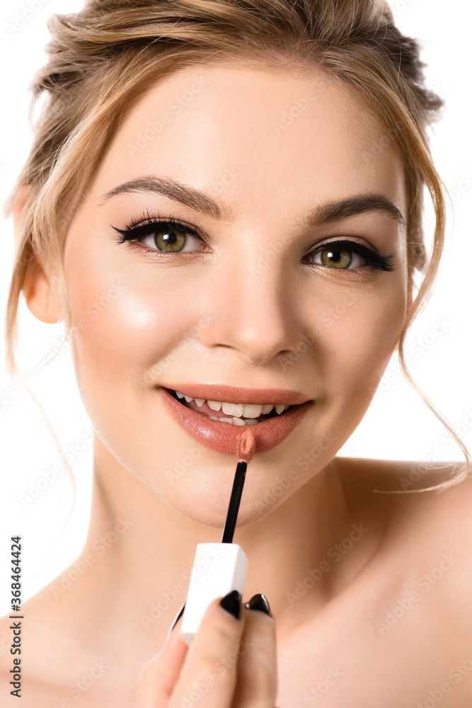 smiling naked beautiful blonde woman with makeup and black nails applying beige lip gloss isolated on white smiling naked beautiful blonde woman with makeup and black nails applying beige lip gloss isolated on white