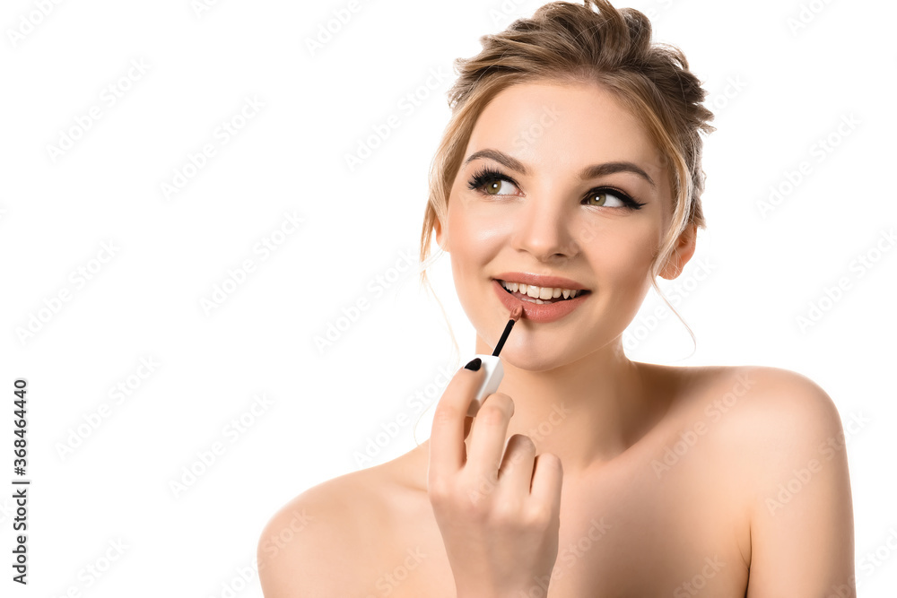 smiling naked beautiful blonde woman with makeup and black nails applying beige lip gloss isolated on white smiling naked beautiful blonde woman with makeup and black nails applying beige lip gloss isolated on white