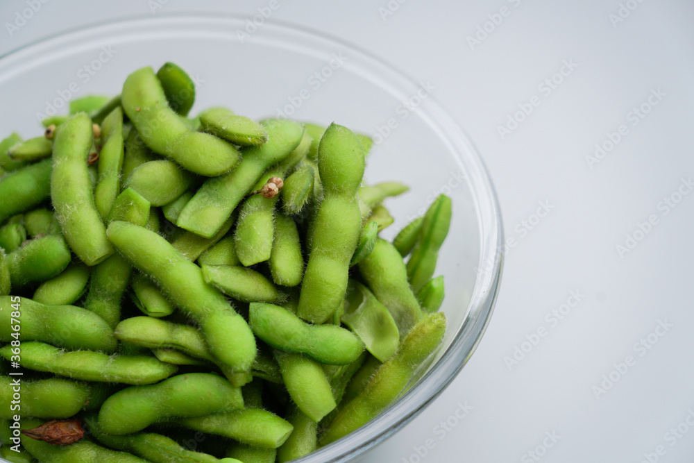 A traditional Chinese delicacy in solid color, boiled soybeans in brine. Chinese traditional food boiled soybean.