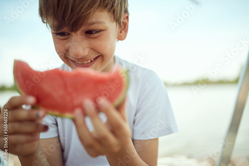 Young boy likes the watermelon