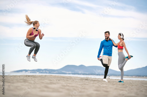 Workout on the Beach. Runners working out. jumping  and fitness workout on the beach.