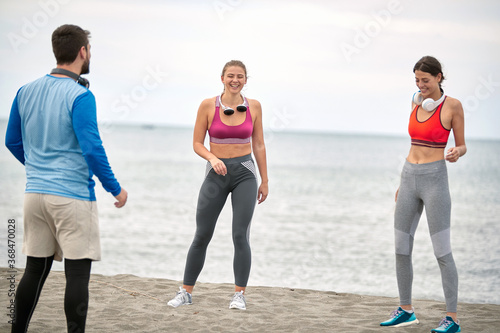 Sport people workout on seaside..Enjoying at vacation and exercise at the beach..