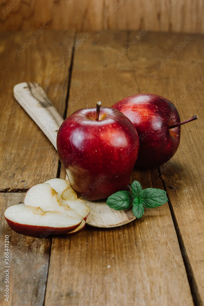 apple on a wooden table apple on a wooden table